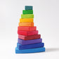 multiple rainbow coloured wooden triangles are stacked on top of each other in a twisted shape